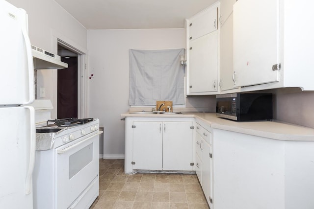 kitchen with white cabinetry, white appliances, and sink