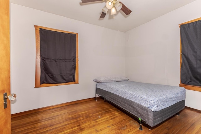 bedroom featuring hardwood / wood-style flooring and ceiling fan