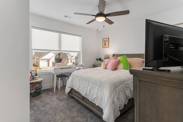 bedroom with a ceiling fan, visible vents, and dark carpet