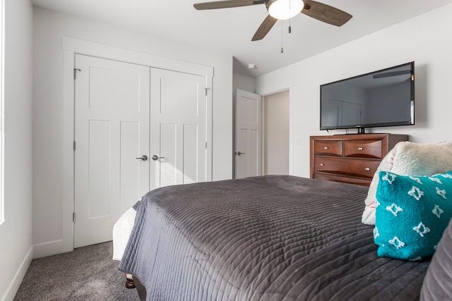 carpeted bedroom featuring a closet, a ceiling fan, and baseboards