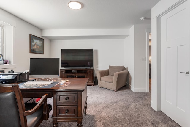 office space featuring baseboards and light colored carpet