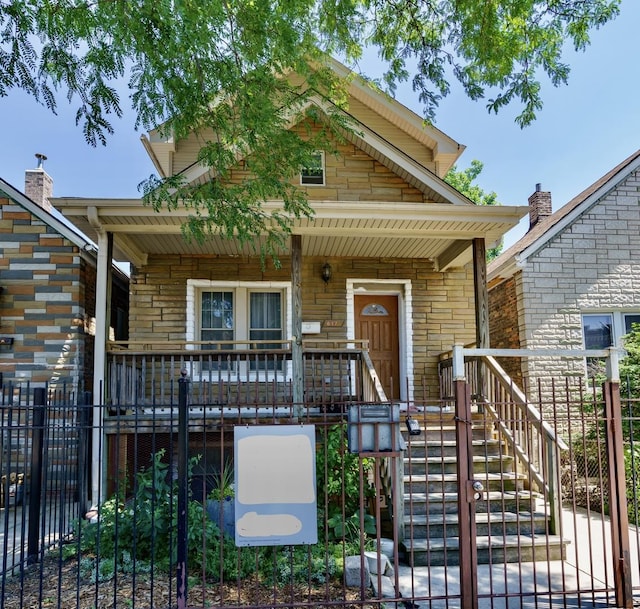 view of front facade with fence and a porch