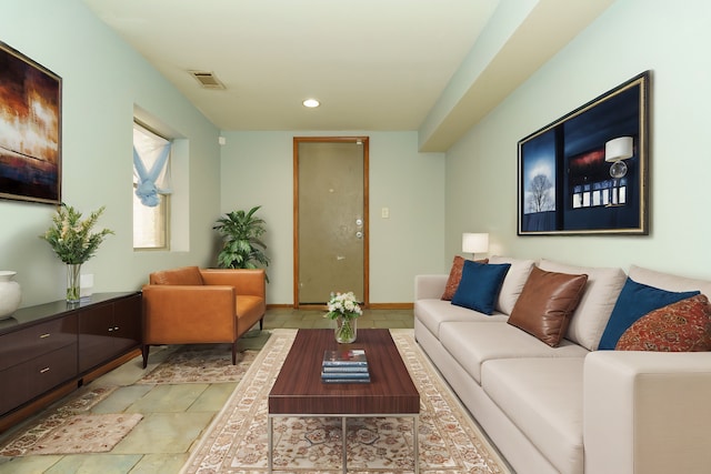 living room with recessed lighting, baseboards, visible vents, and light tile patterned flooring