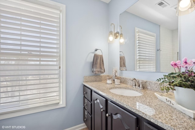 bathroom featuring vanity and visible vents