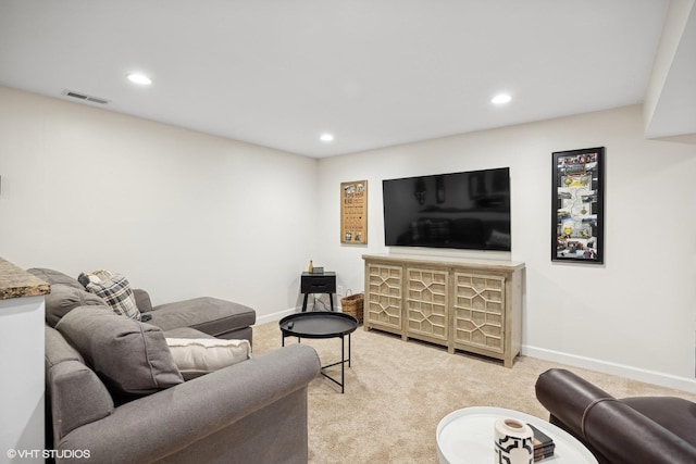 living room featuring light carpet, baseboards, visible vents, and recessed lighting