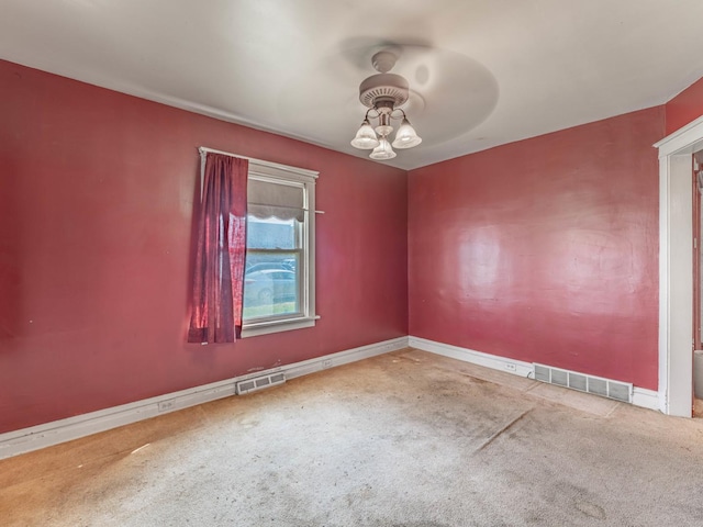 spare room featuring carpet flooring