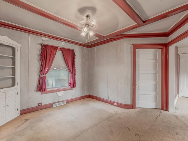 interior space featuring crown molding, carpet floors, and ceiling fan