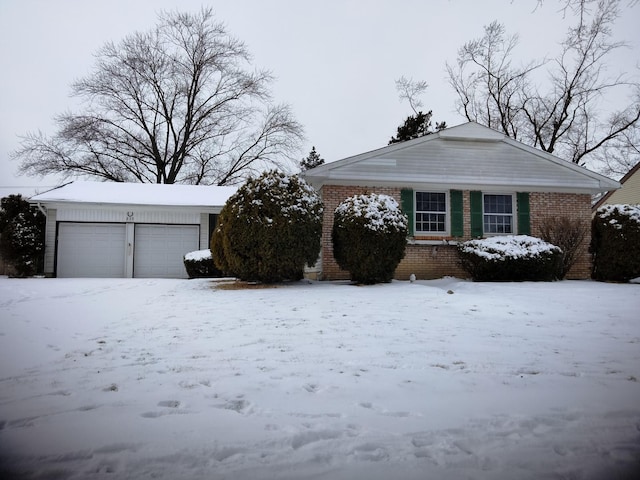 exterior space featuring brick siding and a garage