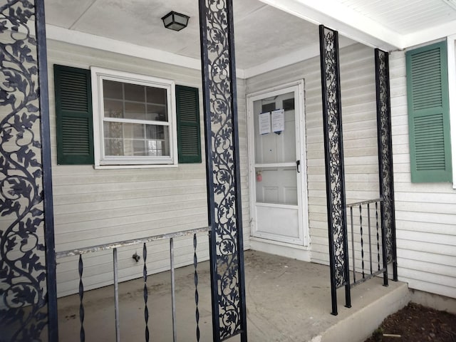 doorway to property featuring covered porch