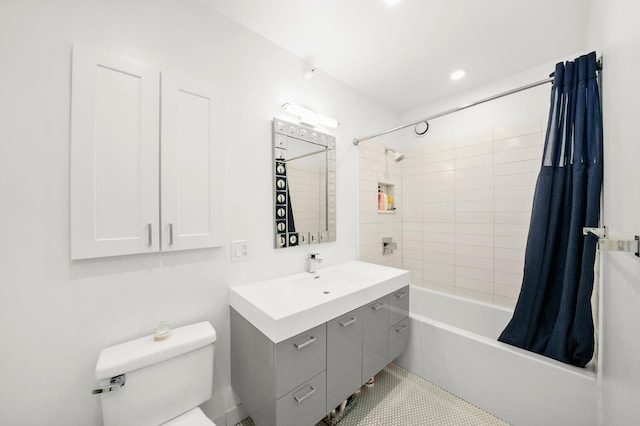 full bathroom with tile patterned floors, vanity, toilet, and shower / bath combo with shower curtain