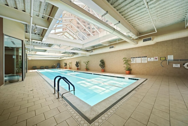 view of pool featuring a skylight