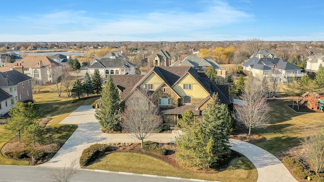 birds eye view of property with a residential view