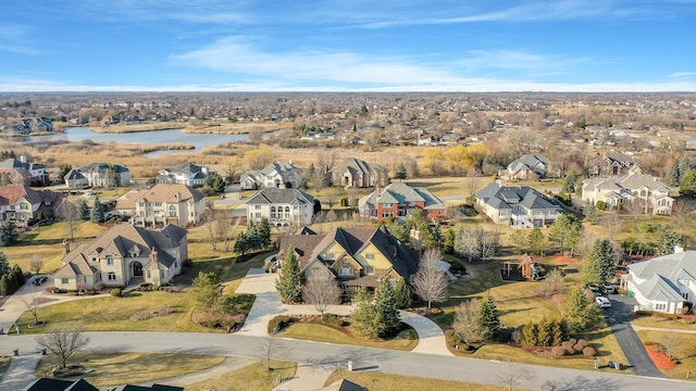 drone / aerial view with a residential view and a water view