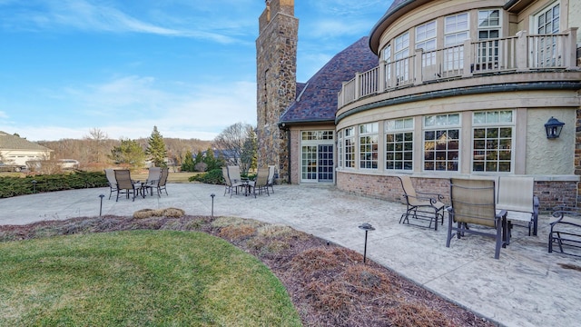 view of patio with a balcony