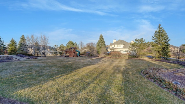 view of yard featuring playground community