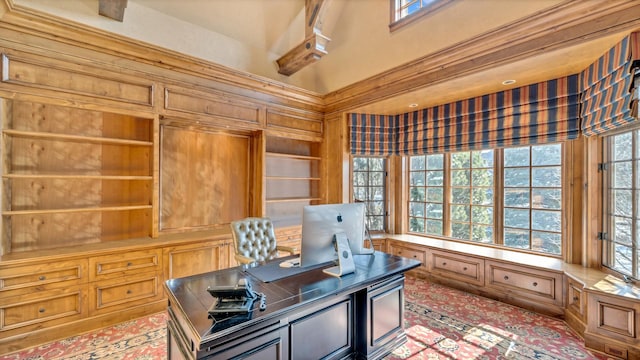 home office featuring a high ceiling and plenty of natural light