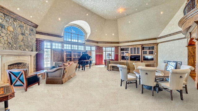 dining area with a high ceiling, carpet flooring, a fireplace, and ornamental molding