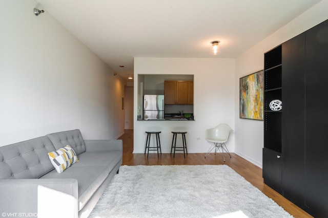 living room with dark hardwood / wood-style flooring