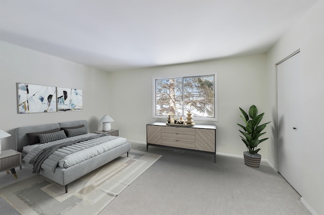 bedroom featuring carpet and baseboards