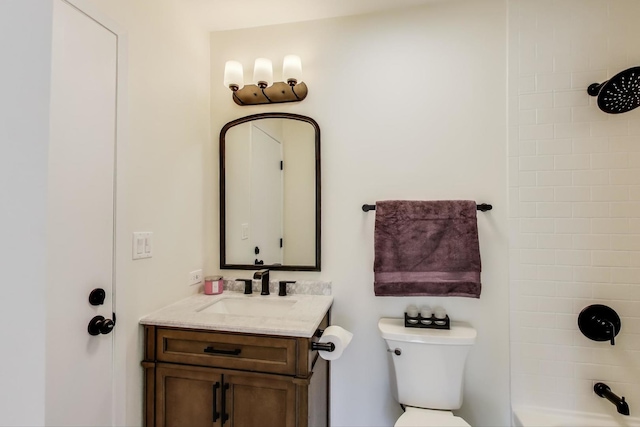 bathroom with toilet, washtub / shower combination, and vanity