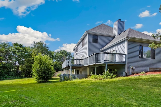 301 Fieldstone Ln, Dixon, IL 61021 - rear view of house with a deck, a chimney, a lawn, and roof with shingles