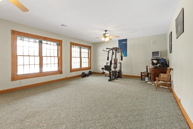 exercise room with carpet flooring and ceiling fan