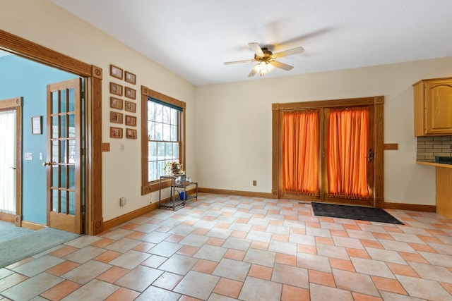 interior space with ceiling fan