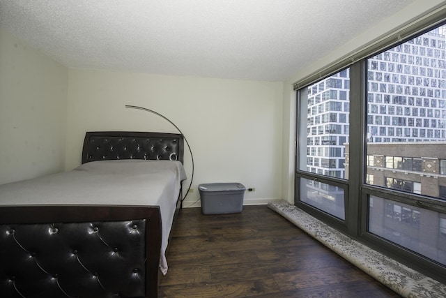 440 N Wabash Ave Unit 1007, Chicago, IL 60611 - bedroom featuring dark wood finished floors and a textured ceiling