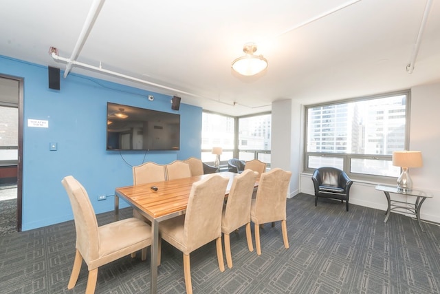440 N Wabash Ave Unit 1007, Chicago, IL 60611 - dining space with baseboards and dark carpet