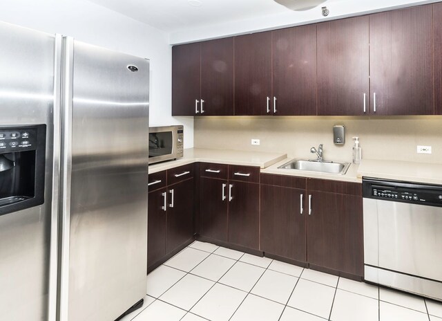 440 N Wabash Ave Unit 1007, Chicago, IL 60611 - kitchen with light tile patterned floors, light countertops, appliances with stainless steel finishes, and a sink