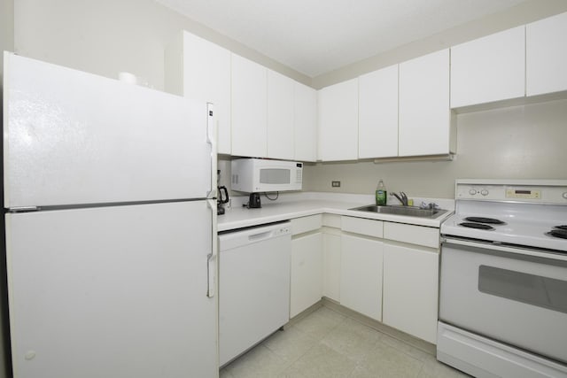 440 N Wabash Ave Unit 1007, Chicago, IL 60611 - kitchen featuring light countertops, white appliances, a sink, and white cabinetry