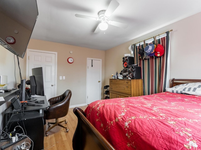 bedroom with hardwood / wood-style flooring and ceiling fan