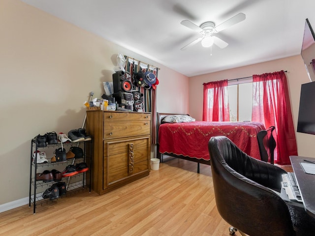 bedroom with ceiling fan and light wood-type flooring