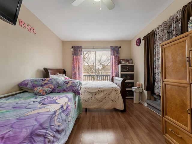 bedroom with ceiling fan and wood-type flooring