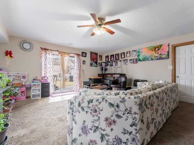 carpeted living room with ceiling fan