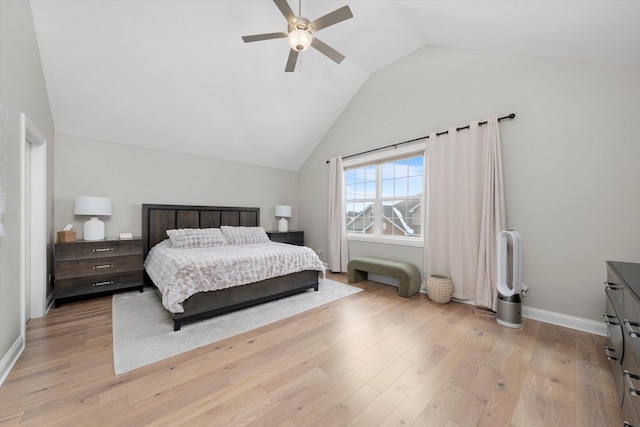 bedroom with vaulted ceiling, baseboards, a ceiling fan, and light wood-style floors