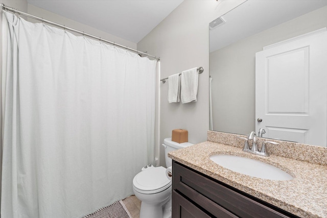 full bathroom with toilet, visible vents, tile patterned flooring, and vanity