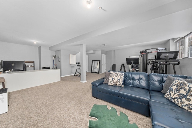 carpeted living room with baseboards