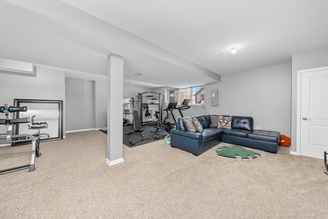 carpeted living room with electric panel and baseboards