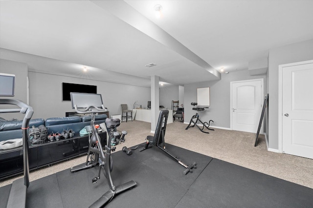 workout room with carpet and baseboards