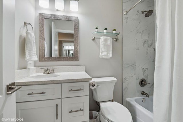 bathroom featuring shower / tub combo, vanity, and toilet