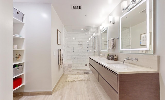 bathroom with vanity and an enclosed shower