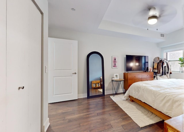 bedroom with dark wood-type flooring and ceiling fan