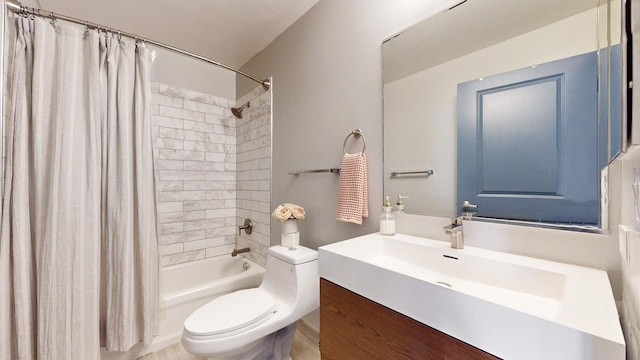 full bathroom featuring shower / bathtub combination with curtain, vanity, and toilet