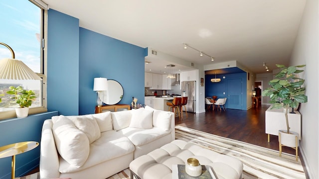 living room with dark hardwood / wood-style flooring