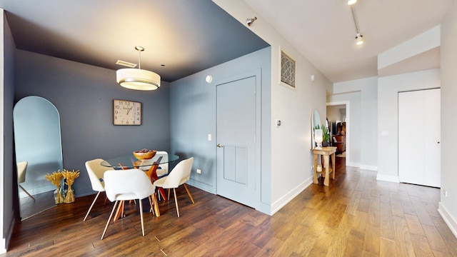 dining space with hardwood / wood-style floors