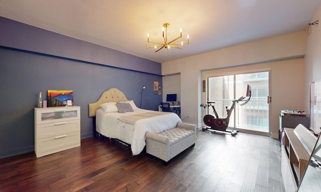 bedroom featuring dark wood-type flooring, access to exterior, and a chandelier