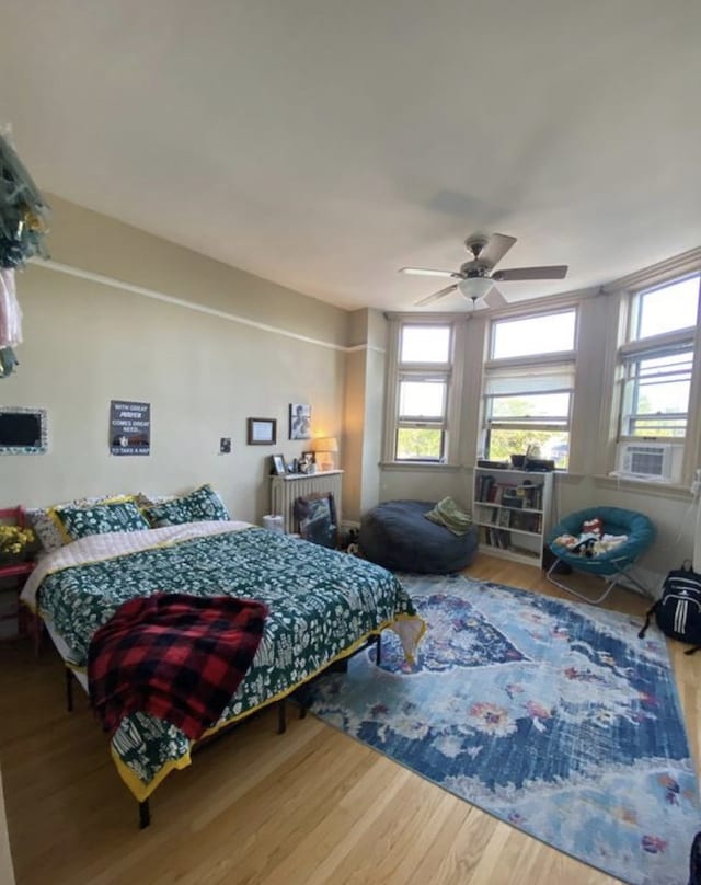 420 N Marion St, Oak Park, IL 60302 - bedroom featuring cooling unit, ceiling fan, and wood finished floors