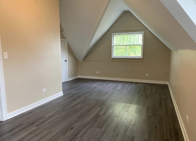 420 N Marion St, Oak Park, IL 60302 - additional living space with vaulted ceiling, dark wood finished floors, and baseboards