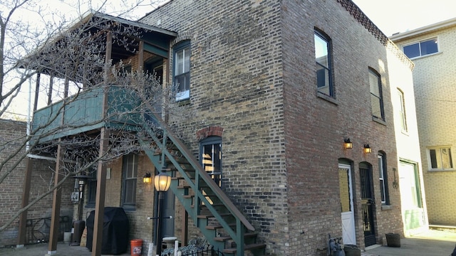 420 N Marion St, Oak Park, IL 60302 - view of home's exterior with stairs and brick siding